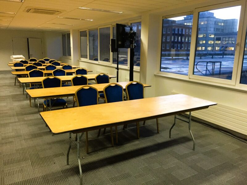 8ft Rectangular Table with Blue Padded Chairs