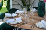 Oak Round Table I Carmen Cutlery I Riedel Glassware I RAK Crockery I Teddy Chair Emerald Green Velvet