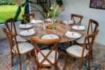 Oak Round Table I Crossback Chairs I Silver Charger Plate I Carmen cutlery I RAK Crockery I Riedel Glassware