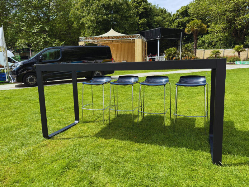 Flow Black Bridge Table with Milano Low Back Black Stools