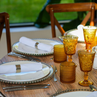 Oak Round Table I Crossback Chairs I Silver Charger Plate I Carmen cutlery I RAK Crockery I Yellow Saturn Glassware