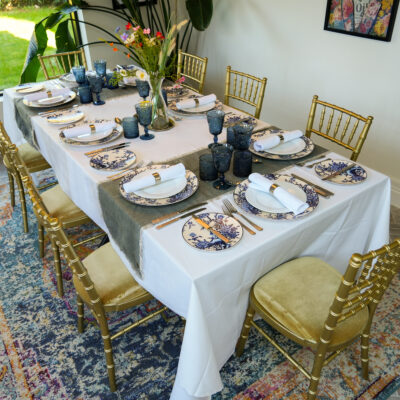 Blue Saturn Range I Blue Floral Crockery I Carmen cutlery I Gold Chiavari Chairs I Rectangular Table I Avant Garde Crockery